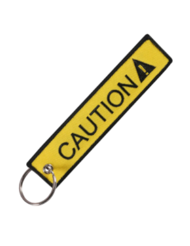 Llavero "Caution" Amarillo